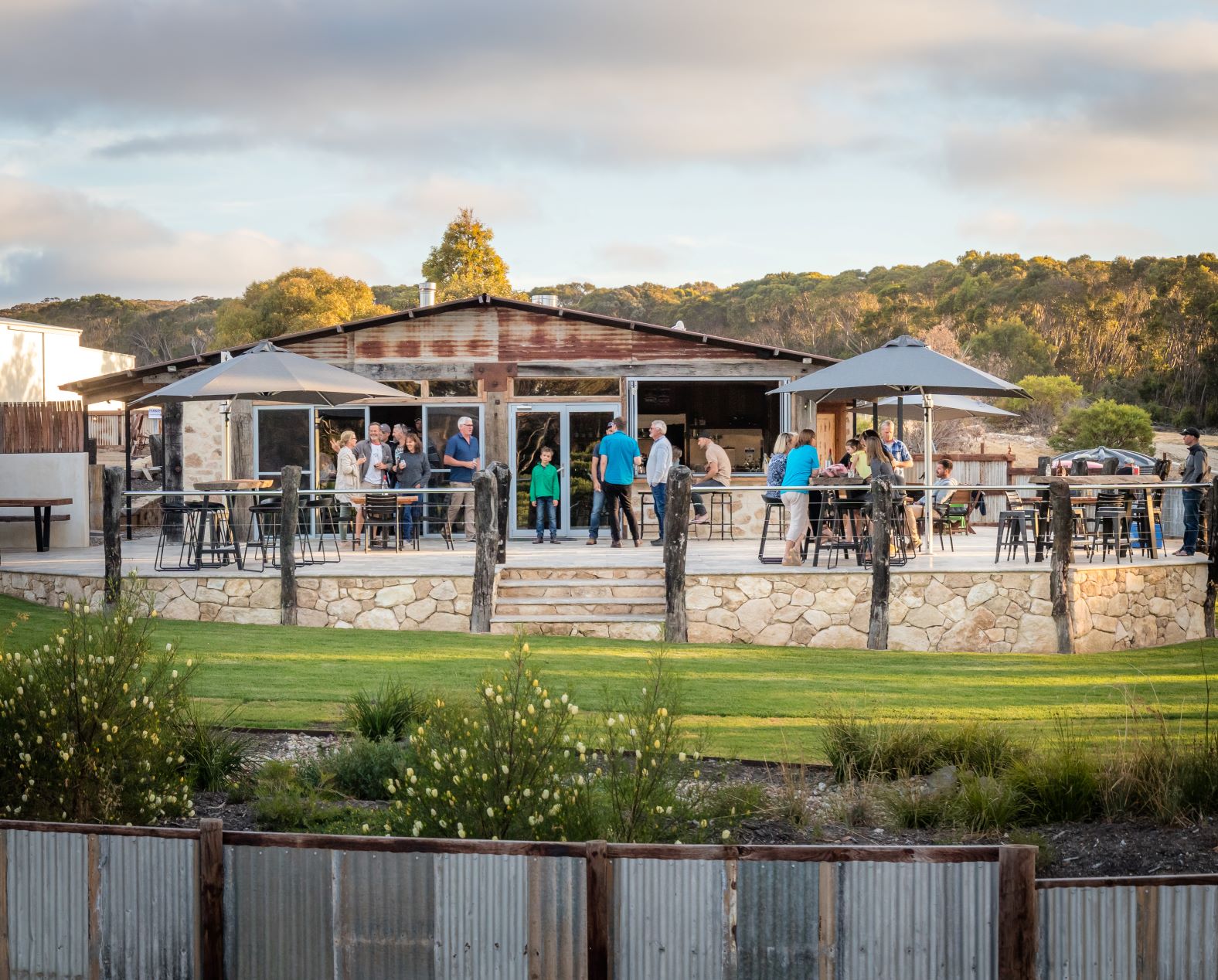 People on the front lawn of False Cape Wines